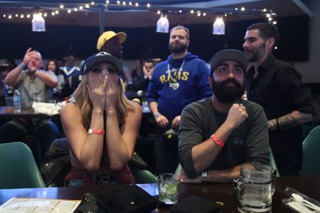 Los Angeles Rams fans react after their team was defeated 13-3 by the New England Patriots during the Super Bowl LIII in Los Angeles on February 3, 2019. (Photo by Mark RALSTON / AFP/Getty Images)