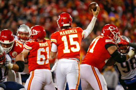 KANSAS CITY, MO - JANUARY 20: Quarterback Patrick Mahomes #15 of the Kansas City Chiefs throws the football in the AFC Championship Game against the New England Patriots at Arrowhead Stadium on January 20, 2019 in Kansas City, Missouri. (Photo by David Eulitt/Getty Images)