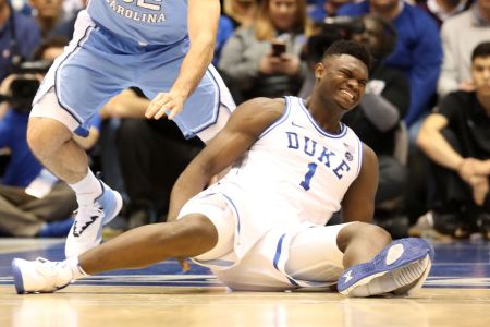 DURHAM, NORTH CAROLINA - FEBRUARY 20: (EDITORS NOTE: Retransmission with alternate crop.) Zion Williamson #1 of the Duke Blue Devils reacts after falling as his shoe breaks in the first half of the game against the North Carolina Tar Heels at Cameron Indoor Stadium on February 20, 2019 in Durham, North Carolina. (Photo by Streeter Lecka/Getty Images)