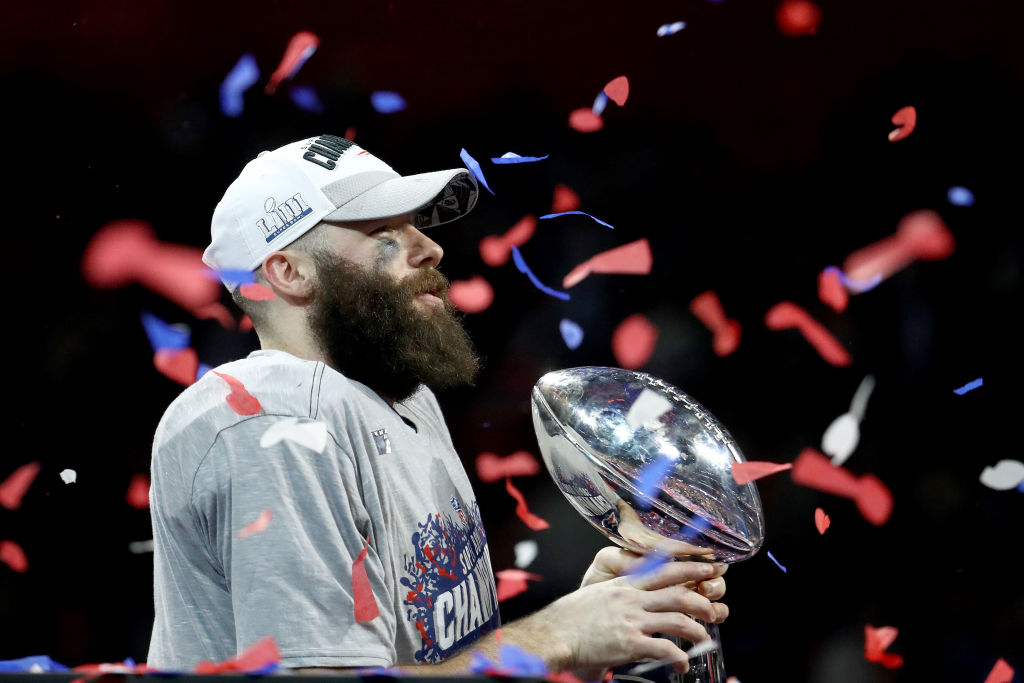 Julian Edelman #11 of the New England Patriots celebrates with the Vince Lombardi Trophy after his teams 13-3 win over the Los Angeles Rams during Super Bowl LIII at Mercedes-Benz Stadium on February 03, 2019 in Atlanta, Georgia. (Photo by Al Bello/Getty Images)
