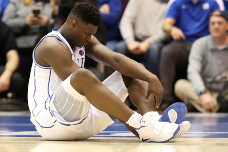 DURHAM, NORTH CAROLINA - FEBRUARY 20: Zion Williamson #1 of the Duke Blue Devils reacts after falling as his shoe breaks against Luke Maye #32 of the North Carolina Tar Heels during their game at Cameron Indoor Stadium on February 20, 2019 in Durham, North Carolina. (Photo by Streeter Lecka/Getty Images)