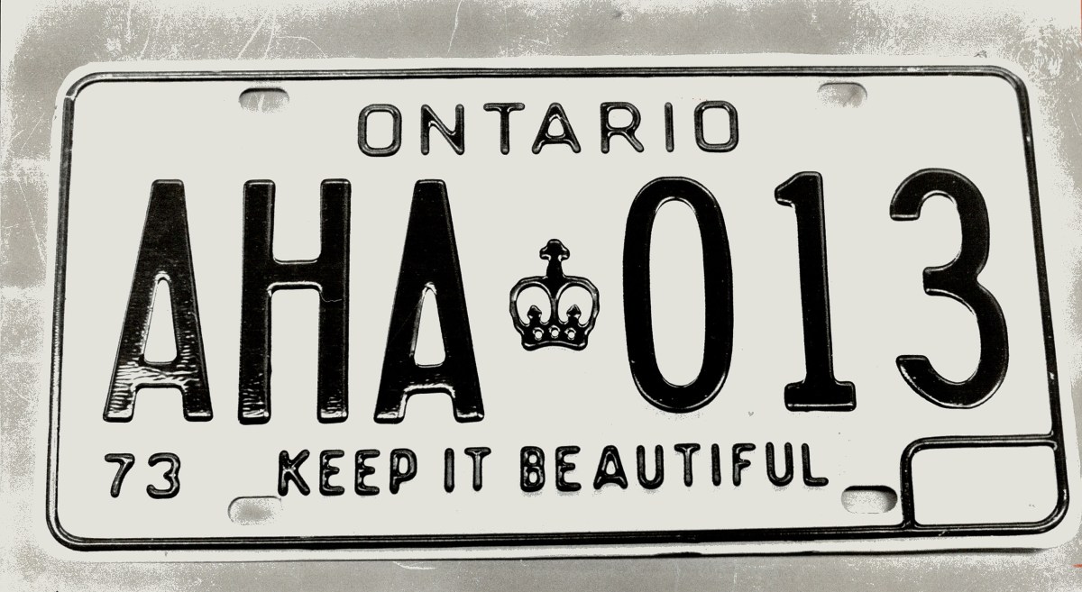 CANADA - FEBRUARY 21: Playing the numbers game is no joke; A penitentiary inmate somewhere played a game while making license plates and at Sudbury; Pauline Robinson found this CO-KANE plate among the others. It will be returned to the Ministry of Communications and Transportation. The ministry complains that 37 per cent of Ontario owners still haven't got their new plates. One who did today found he'd got plates exclaiming aha at unlucky 13. (Photo by Jeff Goode/Toronto Star via Getty Images)
