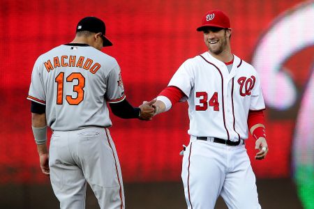  Washington Nationals left fielder Bryce Harper (34) greets Baltimore Orioles third base Manny Machado (13) before a MLB game at Nationals Park, in Washington D.C. (Photo by Tony Quinn/Icon SMI/Corbis via Getty Images)
