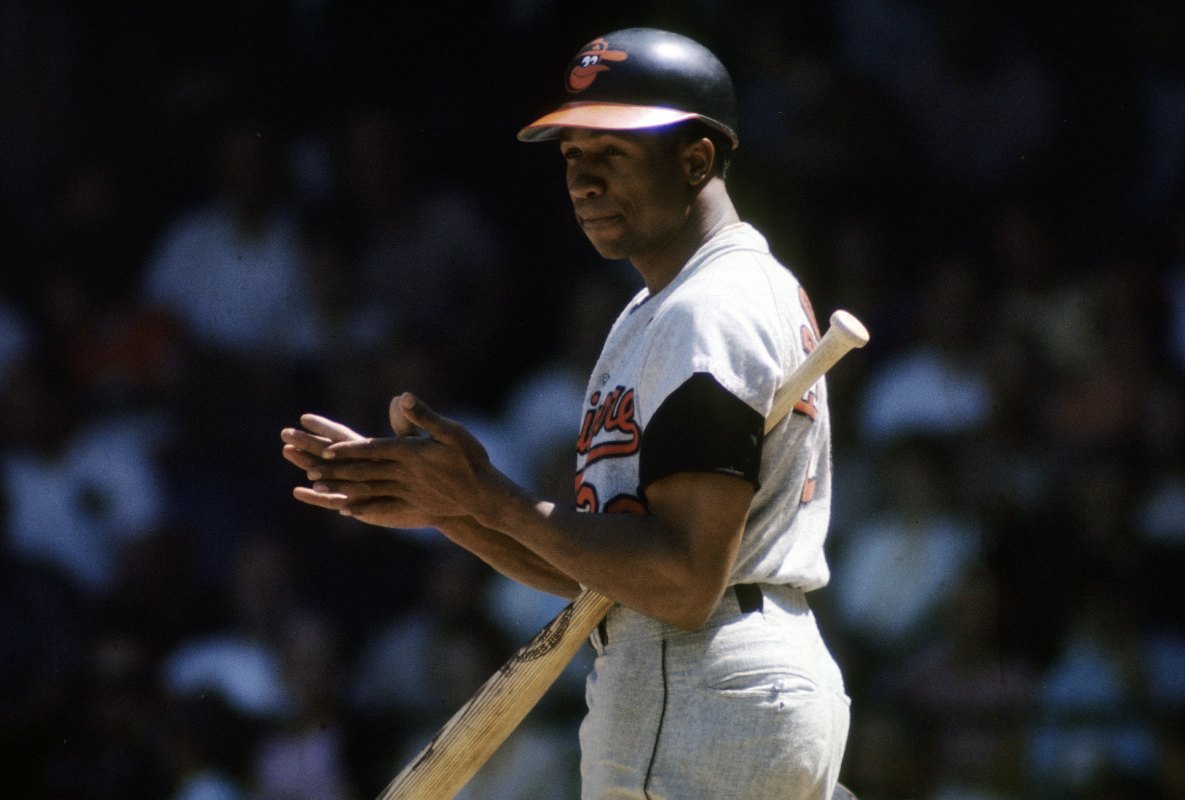 CIRCA 1960s: Outfielder Frank Robinson #20 of the Baltimore Orioles at the plate getting signals from the 3rd base coach during  a circa late 1960s Major League Baseball game. Robinson played for the Orioles from 1966-71. (Photo by Focus on Sport/Getty Images)
