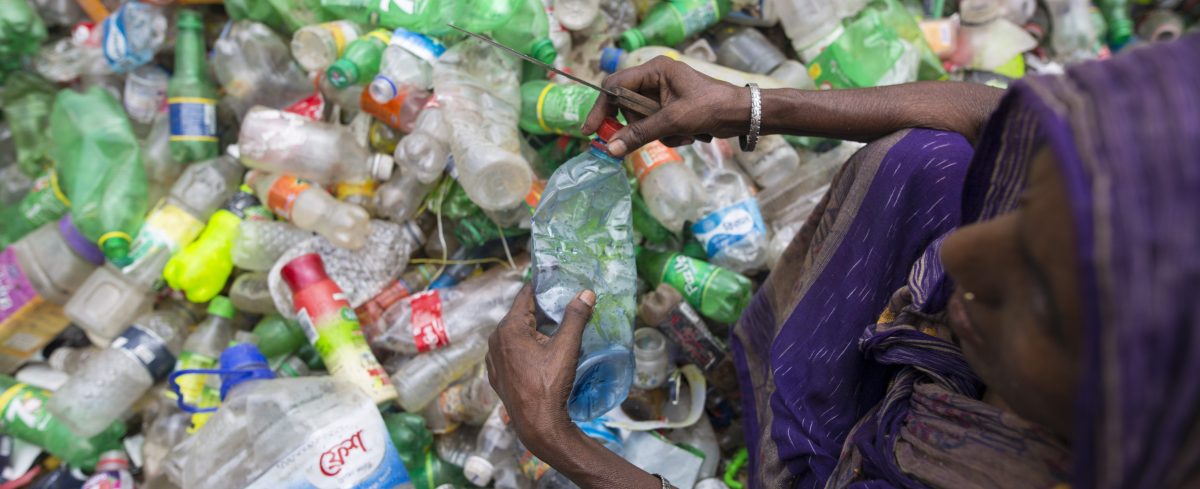 Female laborers sort through polyethylene terephthalate (PET) bottles in a recycling factory on July 06, 2017 in Dhaka, Bangladesh. (Zakir Chowdhury/Barcroft Images / Barcroft Media via Getty Images)