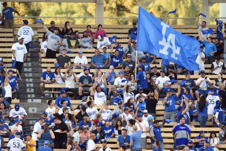 LOS ANGELES, CA - OCTOBER 07: A fan in the left field pavilion runs through the crowd with an LA flag during game 2 of the NLDS between the Arizona Diamondbacks and the Los Angeles Dodgers on October 07, 2017 at Dodger Stadium in Los Angeles, CA. (Photo by Chris Williams/Icon Sportswire via Getty Images)