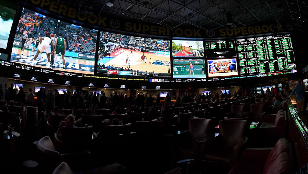 Guests attend a viewing party for the NCAA Men's College Basketball Tournament inside the 25,000-square-foot Race & Sports SuperBook at the Westgate Las Vegas Resort & Casino which features 4,488-square-feet of HD video screens on March 15, 2018 in Las Vegas, Nevada. (Photo by Ethan Miller/Getty Images)