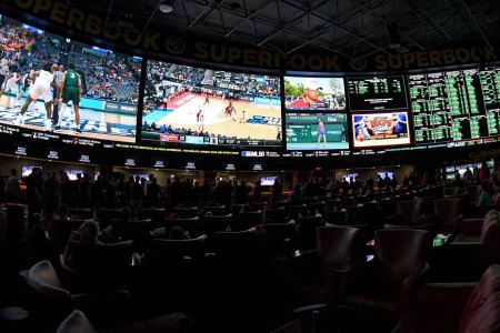Guests attend a viewing party for the NCAA Men's College Basketball Tournament inside the 25,000-square-foot Race & Sports SuperBook at the Westgate Las Vegas Resort & Casino which features 4,488-square-feet of HD video screens on March 15, 2018 in Las Vegas, Nevada. (Photo by Ethan Miller/Getty Images)