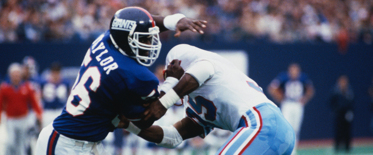 EAST RUTHERFORD, NJ: Lawrence Taylor #56 of the New York Giants pass rushes against the Houston Oilers during a circa 1980s game at Giants Stadium in East Rutherford, New Jersey. Taylor played for the Giants from 1981-93. (Photo by Focus Sport/Getty Images)
