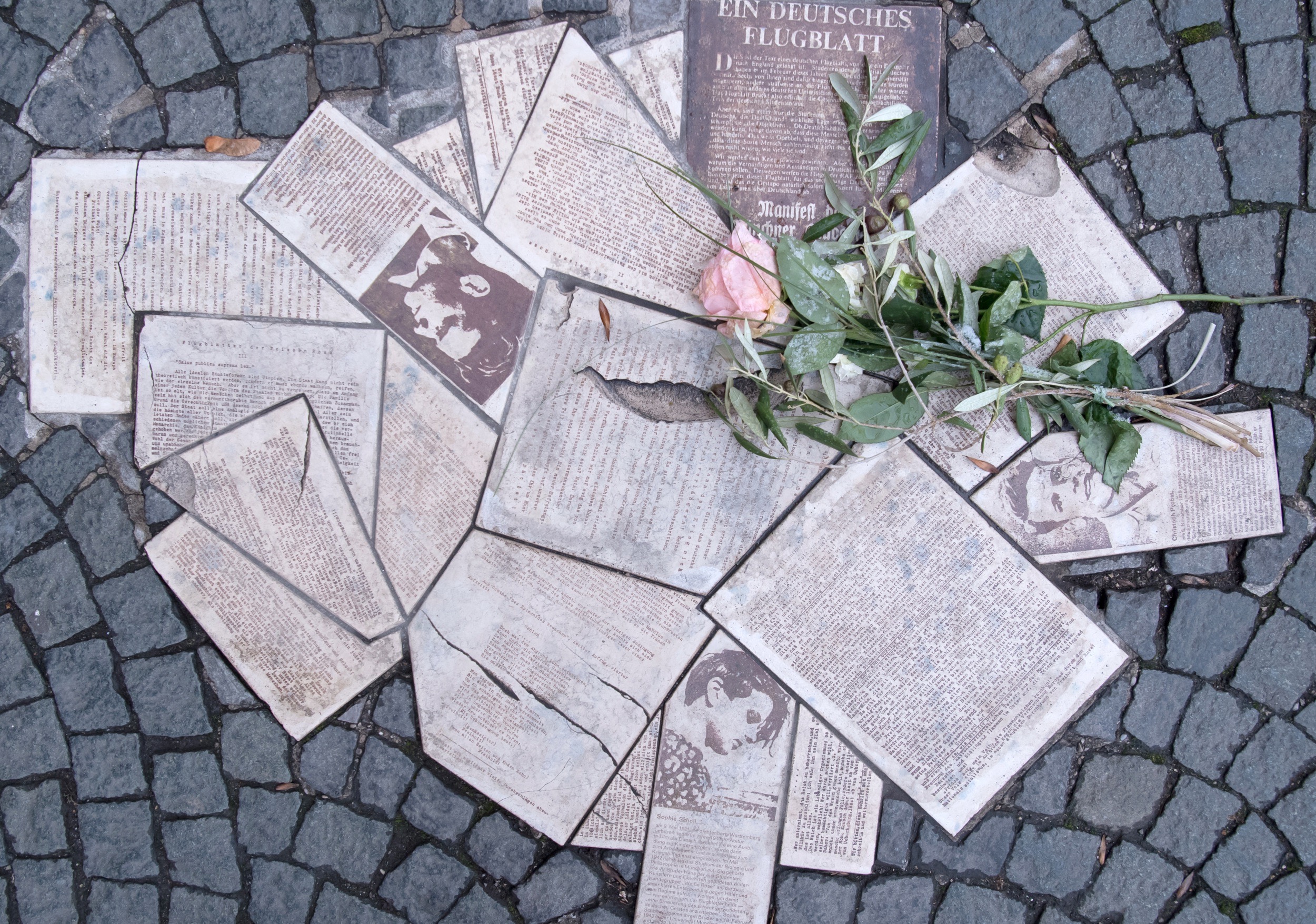 In front of the entrance to the main building of the Ludwig-Maximilians-Universit√§t (LMU) at Geschwister-Scholl-Platz the leaflets of the resistance group "White Rose" are embedded in the ground as a monument in 2018. (Photo by Sven Hoppe/picture alliance via Getty Images)