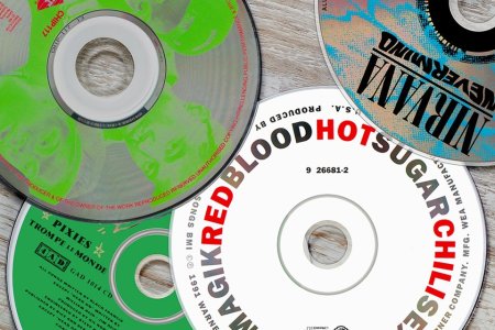 Photo illustration of CDs from Nirvana, the Red Hot Chili Peppers and other bands that released albums on Sept. 24, 1991