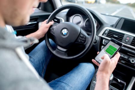 A young man is sitting at a driving safety center. (Photo by Hauke-Christian Dittrich/picture alliance via Getty Images)