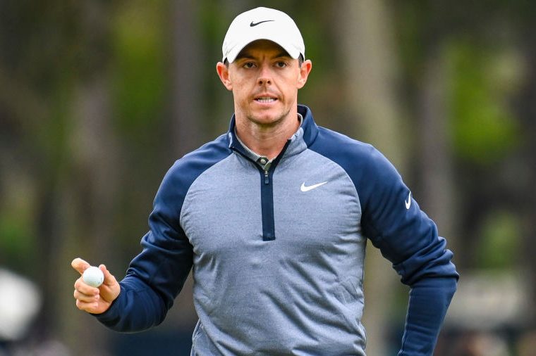Golfer Rory McIlroy in a Nike hat and zip-up