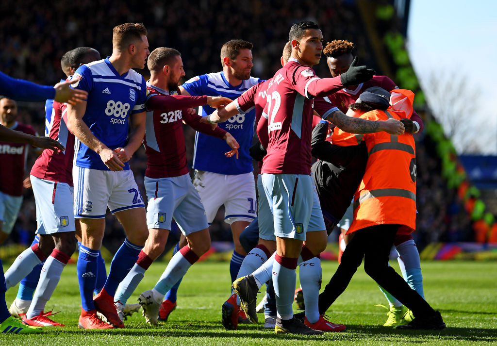 A fan is wrestled to the ground by a steward after punching Jack Grealish of Aston Villa during the Sky Bet Championship match between Birmingham City and Aston Villa at St Andrew's Trillion Trophy Stadium on March 10, 2019 in Birmingham, England. (Photo by Alex Davidson/Getty Images)