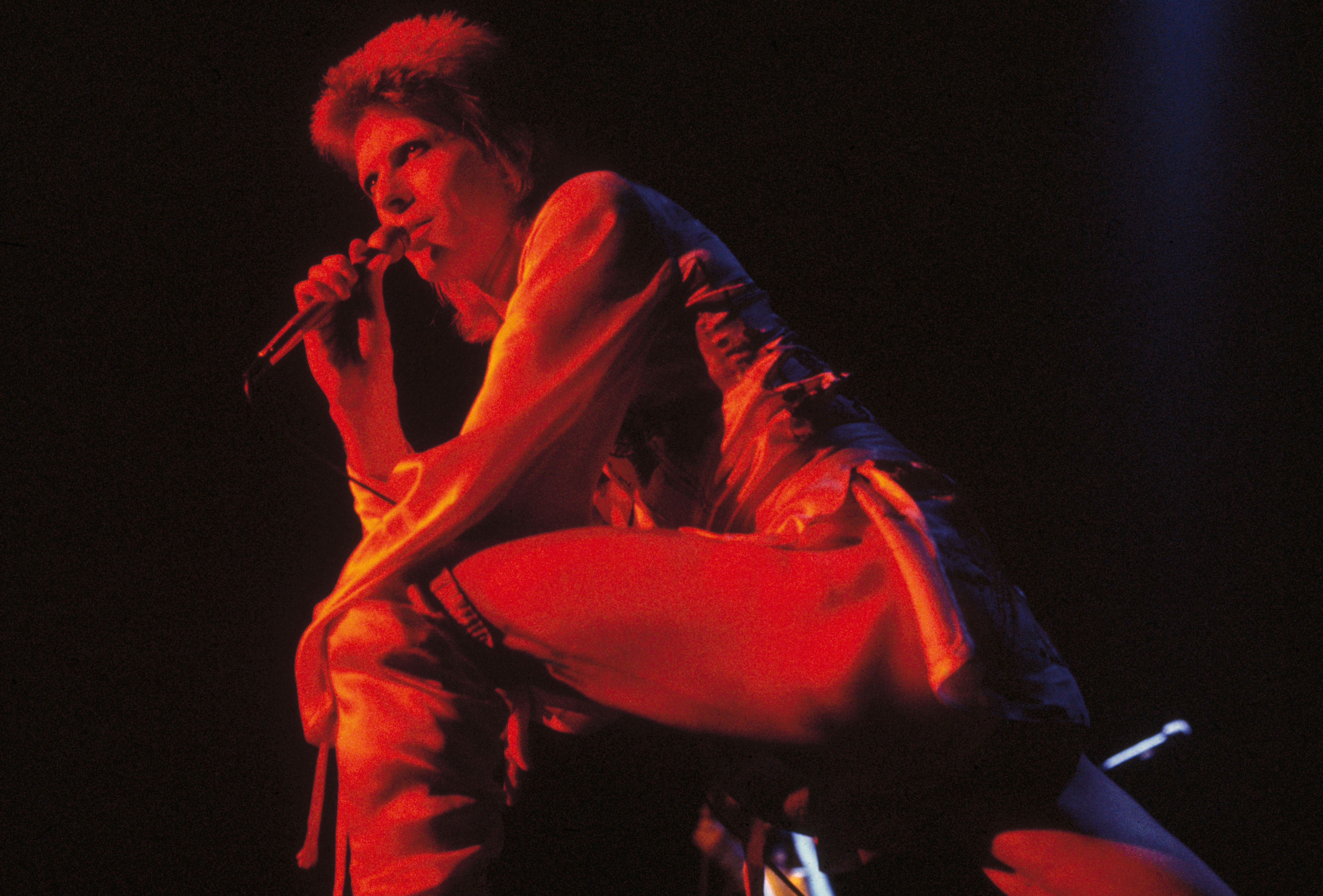David Bowie performing as Ziggy Stardust at the Hammersmith Odeon, 1973. (Getty Images)