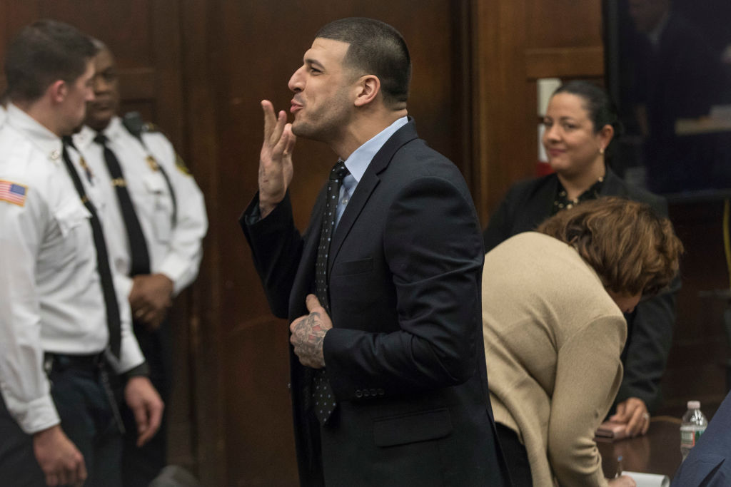 BOSTON, MA - APRIL 12: Former New England Patriots tight end Aaron Hernandez blows a kiss to his fiancées Shayanna Jenkins from the defense table during jury deliberations in his double murder trial at Suffolk Superior Court in Boston on Apr. 12, 2017. Hernandez is charged in the July 2012 killings of Daniel de Abreu and Safiro Furtado who he encountered in a Boston nightclub. The former NFL football player already is serving a life sentence in the 2013 killing of semi-professional football player Odin Lloyd. (Photo by Keith Bedford/The Boston Globe via Getty Images)