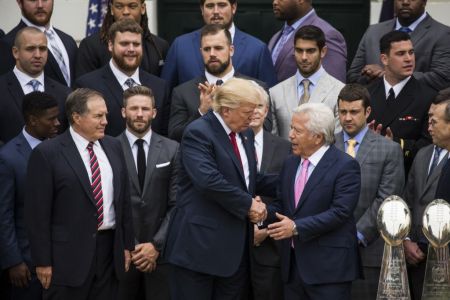Robert Kraft (right), owner of the New England Patriots, is shown here shaking hands with President Donald Trump at the White House on April 19, 2017. (Photo by Samuel Corum/Anadolu Agency/Getty Images)