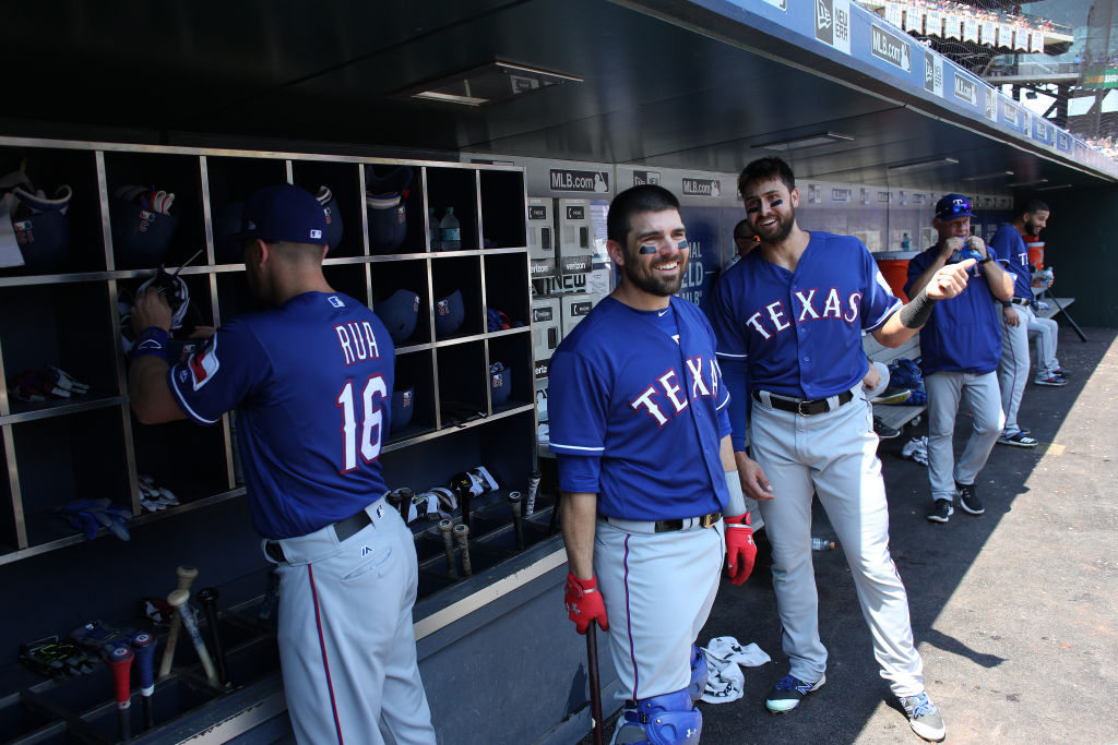 NEW YORK, NEW YORK - August 9:  Brett Nicholas #6 of the Texas Rangers and Joey Gallo #13 of the Texas Rangers in the dugout preparing to bat during the Texas Rangers Vs New York Mets regular season MLB game at Citi Field on August 9, 2017 in New York City. (Photo by Tim Clayton/Corbis via Getty Images)
