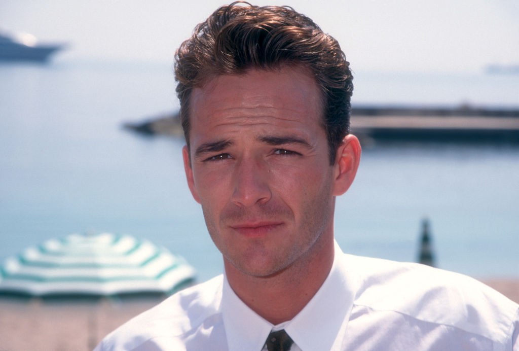 Luke Perry, who died in early March at the age of 52, embodied the detached irony of the 1990s in his teen idol role of "Dylan" on Fox's primetime soap series "Beverly Hills, 90210." (Photo by Ron Davis/Getty Images; 1995)
