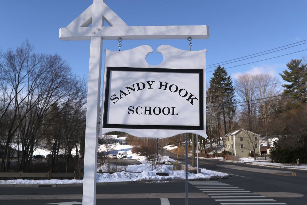 A sign stands near the site of the December 2012 Sandy Hook school shooting on the day of the National School Walkout on March 14, 2018 in Sandy Hook Connecticut. Several hundred students at the school, near the site of the Sandy Hook school massacre of December 14, 2012, staged a protest one month after 17 people were killed at Stoneman Douglas High School in Parkland, Florida. Media and visitors were not allowed on the Newtown High campus for the event.  (Getty Images)