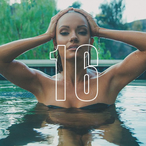 A woman rising out of a pool and striking a pose, with an overlay of the number "16"