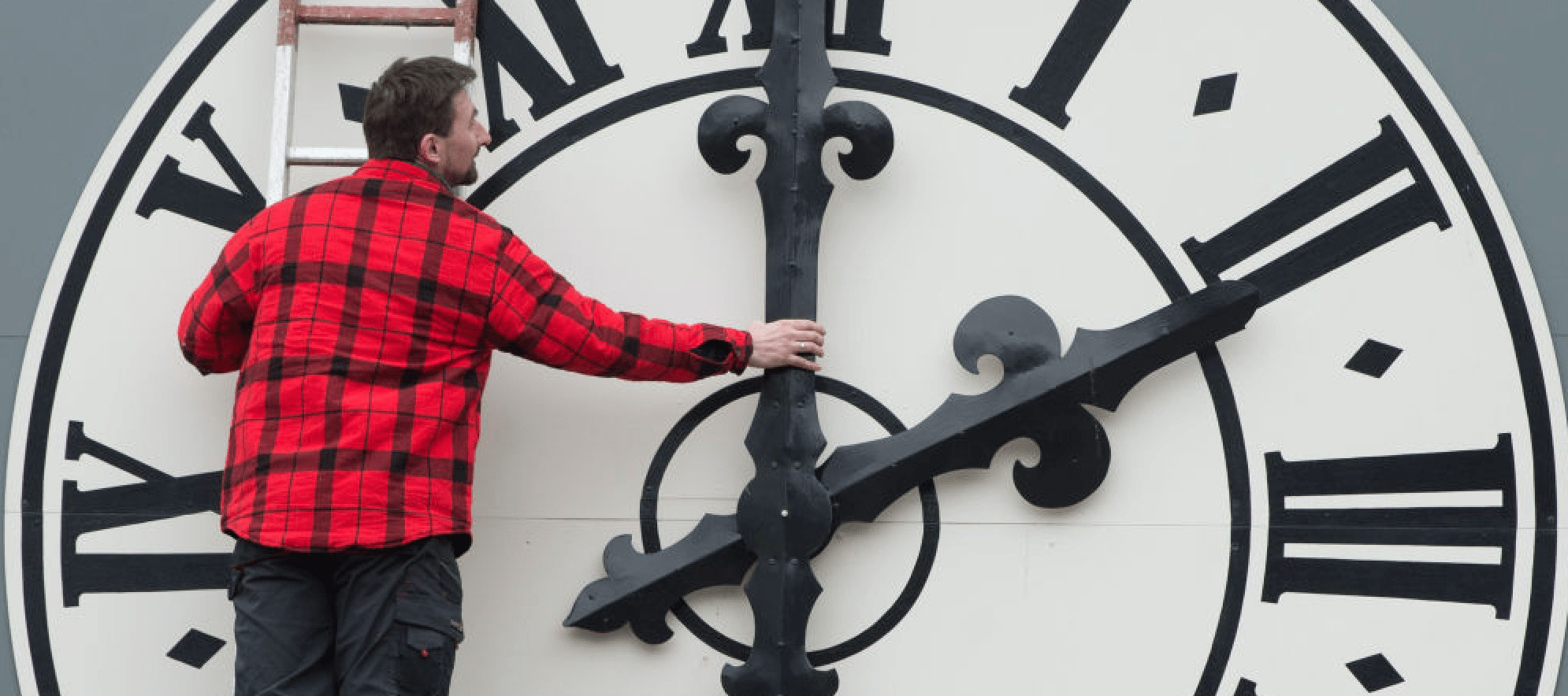 Picture taken on March 23, 2018 shows a technician working on the clock of the Lukaskirche Church in Dresden, eastern Germany. (SEBASTIAN KAHNERT/AFP/Getty Images)