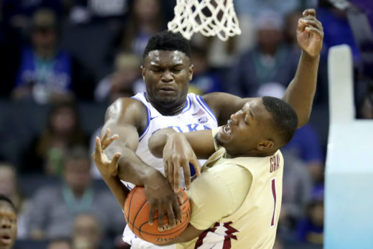 Zion Williamson blocks a shot by Raiquan Gray (Photo by Streeter Lecka/Getty Images)
