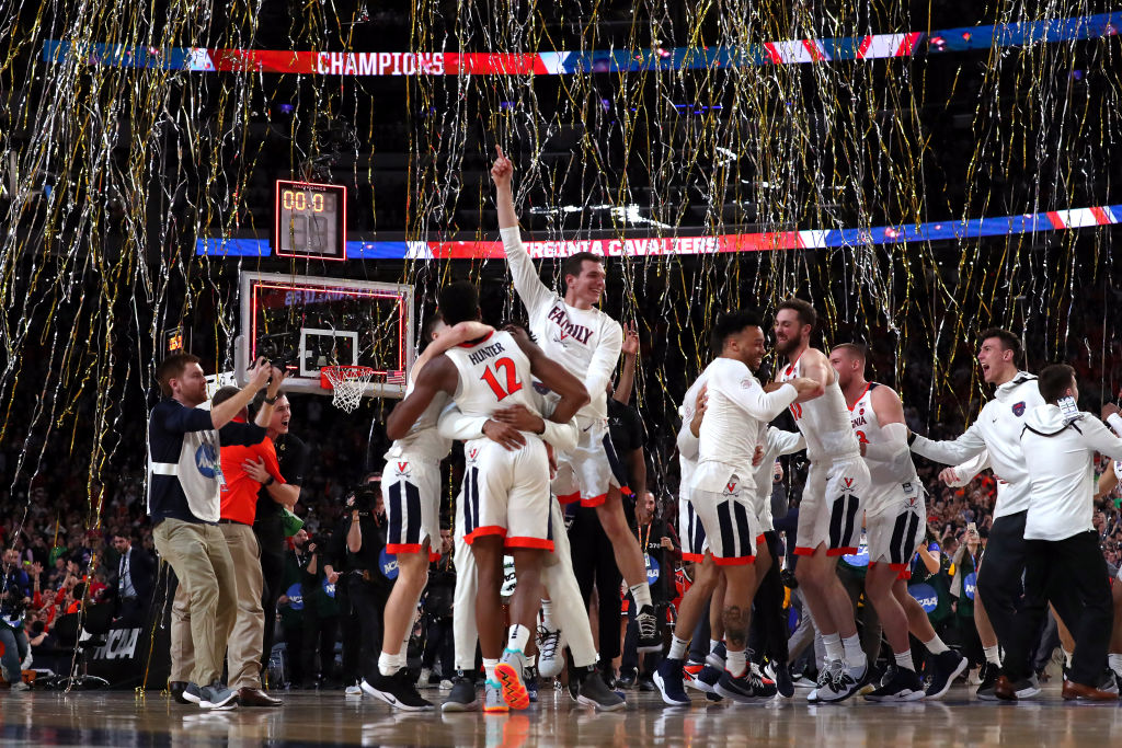 The Virginia Cavaliers celebrate their 85-77 win over Texas Tech. (Photo by Tom Pennington/Getty Images)