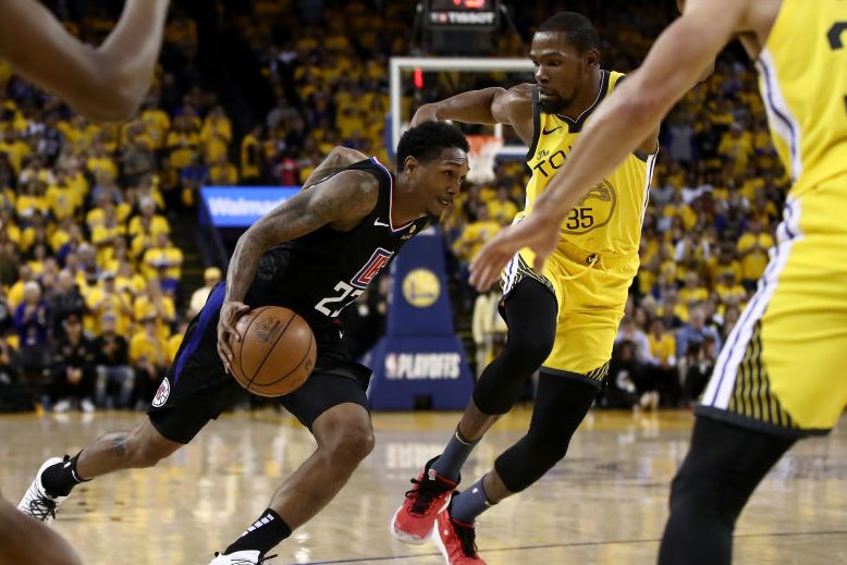 Lou Williams of the Clippers drives on Kevin Durant of the Warriors. (Photo by Ezra Shaw/Getty Images)