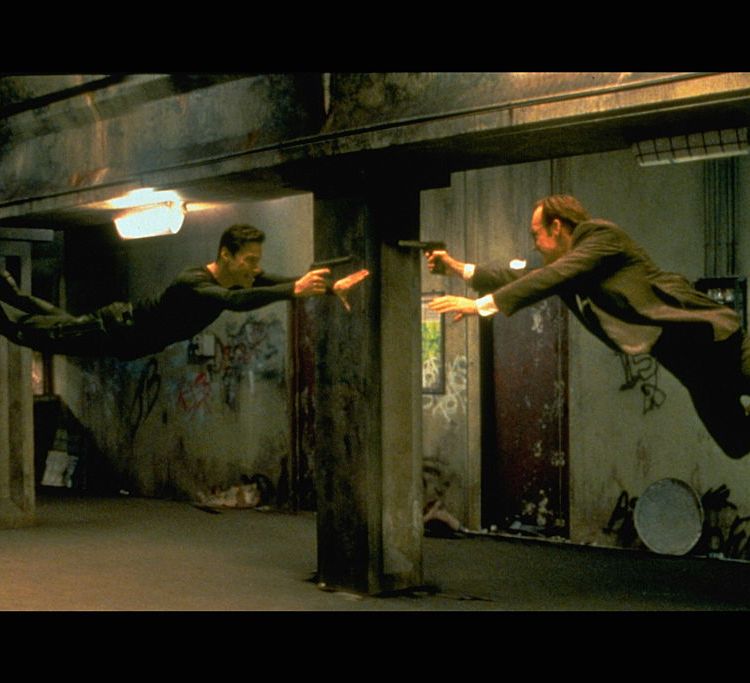 Keanu Reeves and Hugo Weaving in scene from "The Matrix." 