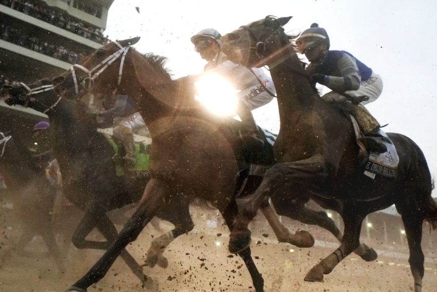 The field heads toward the first turn during the 144th running of the Kentucky Derby. (Photo by Rob Carr/Getty Images)