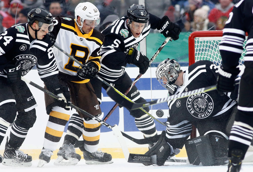 The Boston Bruins and Chicago Blackhawks in their Winter Classic sweaters. (Mark Blinch/NHLI via Getty)
