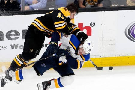 Torey Krug rocks St. Louis Blues winger Robert Thomas. (Fred Kfoury III/Icon Sportswire via Getty)