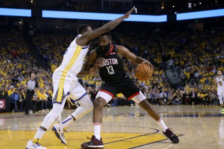 James Harden drives on Draymond Green. (Ezra Shaw/Getty Images)