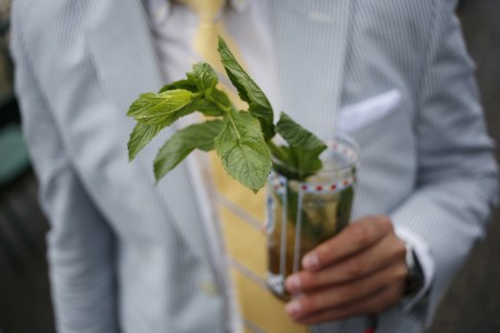 A racegoer holds a mint julep via Getty Images