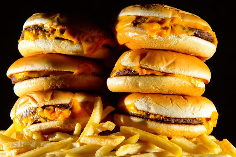 A pile of cheeseburgers and french fries. (Dominic Lipinski/PA Wire/Getty)