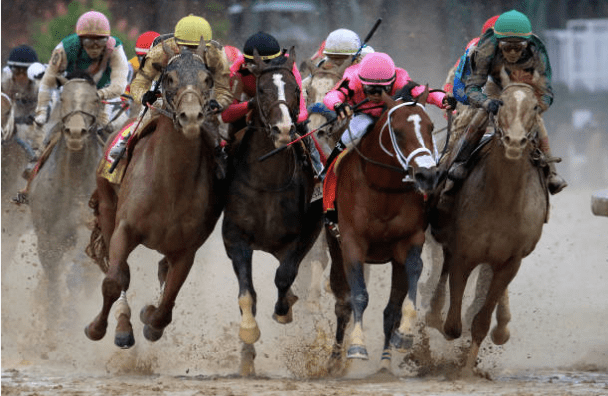 Jockeys fight for position during the 145th running of the Kentucky Derby at Churchill Downs. (Andy Lyons/Getty Images)