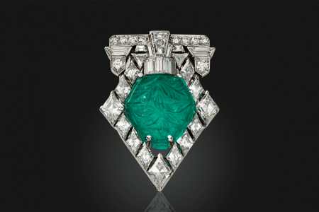 A Tiffany Art Deco carved emerald and diamond brooch