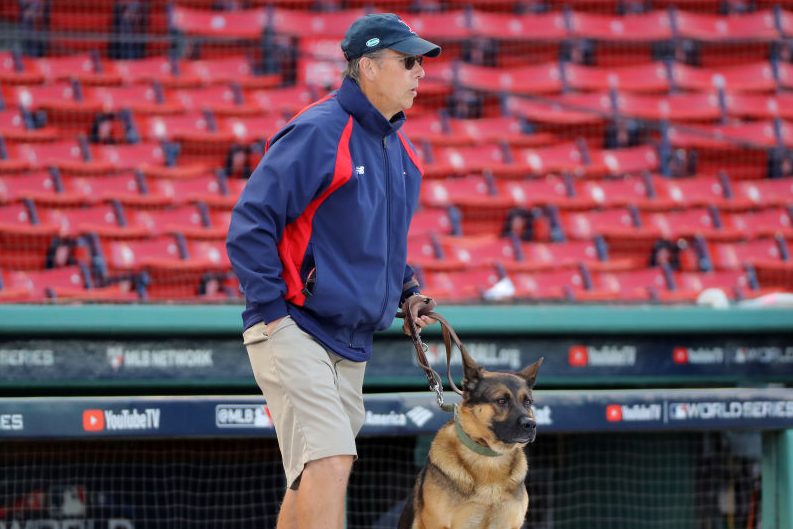 David Mellor, Senior Director of Grounds for the Boston Red Sox, and his dog Drago. (Alex Trautwig/MLB Photos via Getty)