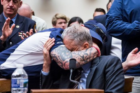 FealGood Foundation co-founder John Feal hugs Jon Stewart. (Zach Gibson/Getty)