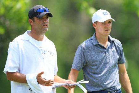 Jordan Spieth talks with his caddie Michael Greller on June 01, 2019. (Photo by Sam Greenwood/Getty)