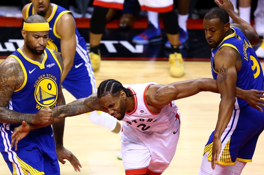 Kawhi Leonard defended by DeMarcus Cousins and Andre Iguodala. (Vaughn Ridley/Getty)
