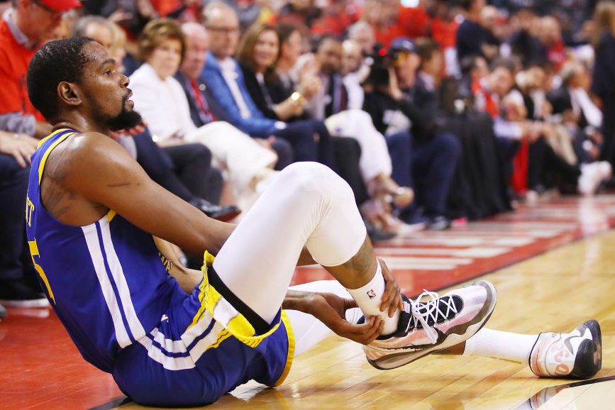 Kevin Durant reacts after sustaining an injury in the NBA Finals. (Gregory Shamus/Getty)