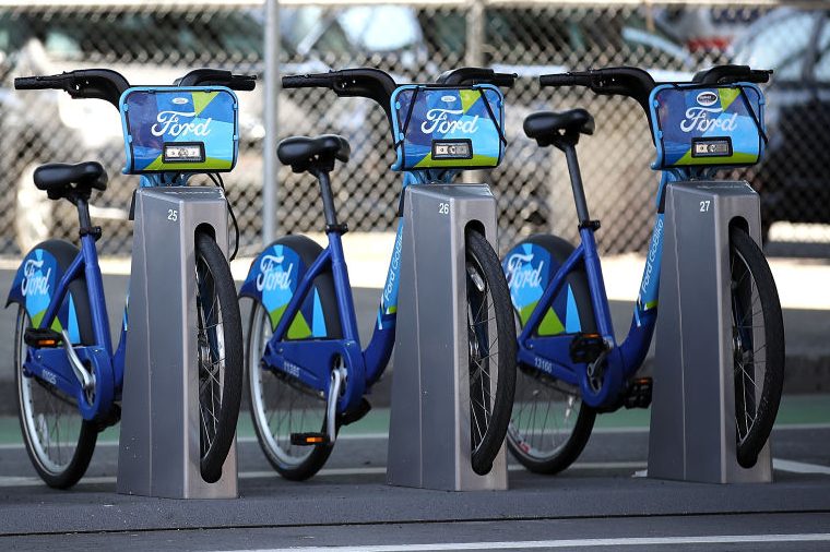 Ford GoBikes sit in a dock in San Francisco. (Justin Sullivan/Getty)