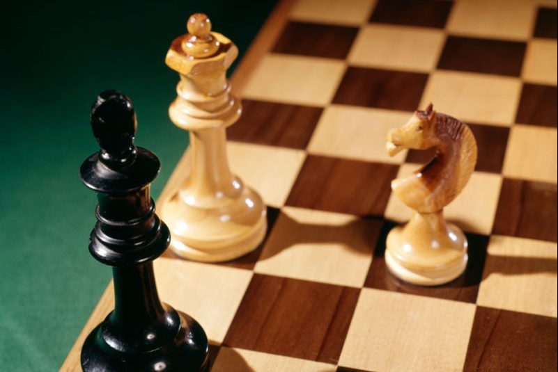 Three pieces on a chessboard. (H. Armstrong Roberts/ClassicStock/Getty)