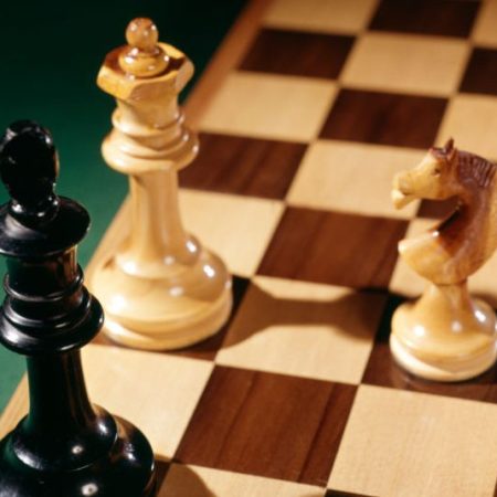 Three pieces on a chessboard. (H. Armstrong Roberts/ClassicStock/Getty)