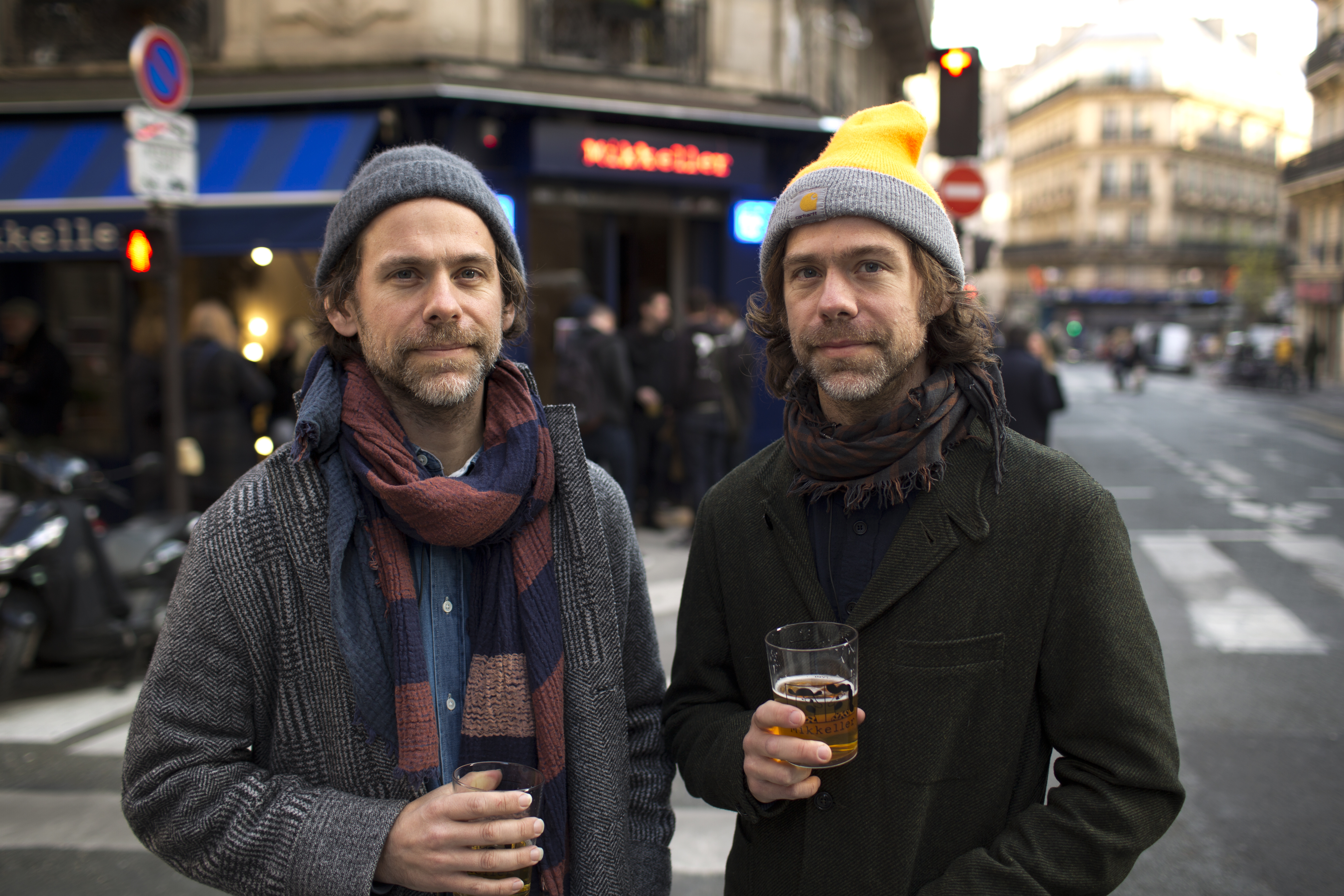The Dessner brothers have a beer outside their new bar in Paris