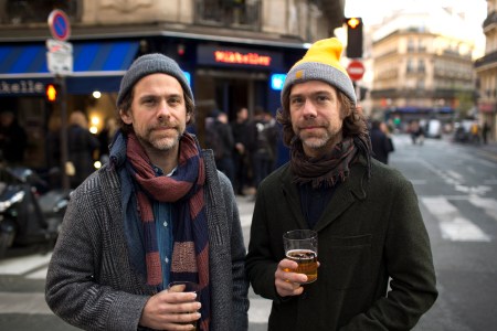 The Dessner brothers have a beer outside their new bar in Paris 