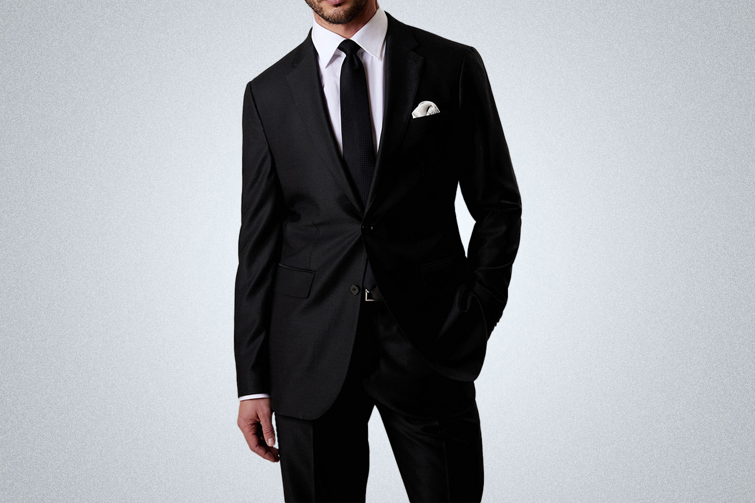 a model in a black Banana Republictravel blazer on a grey background