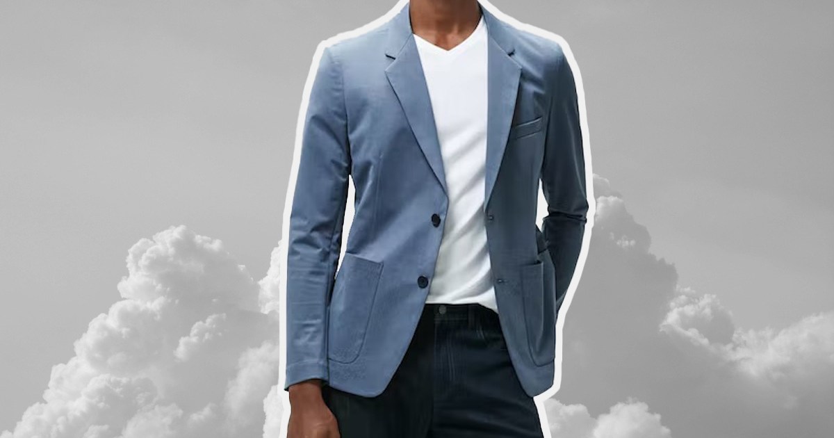 a model in a travel blazer on top of a cloud-like background